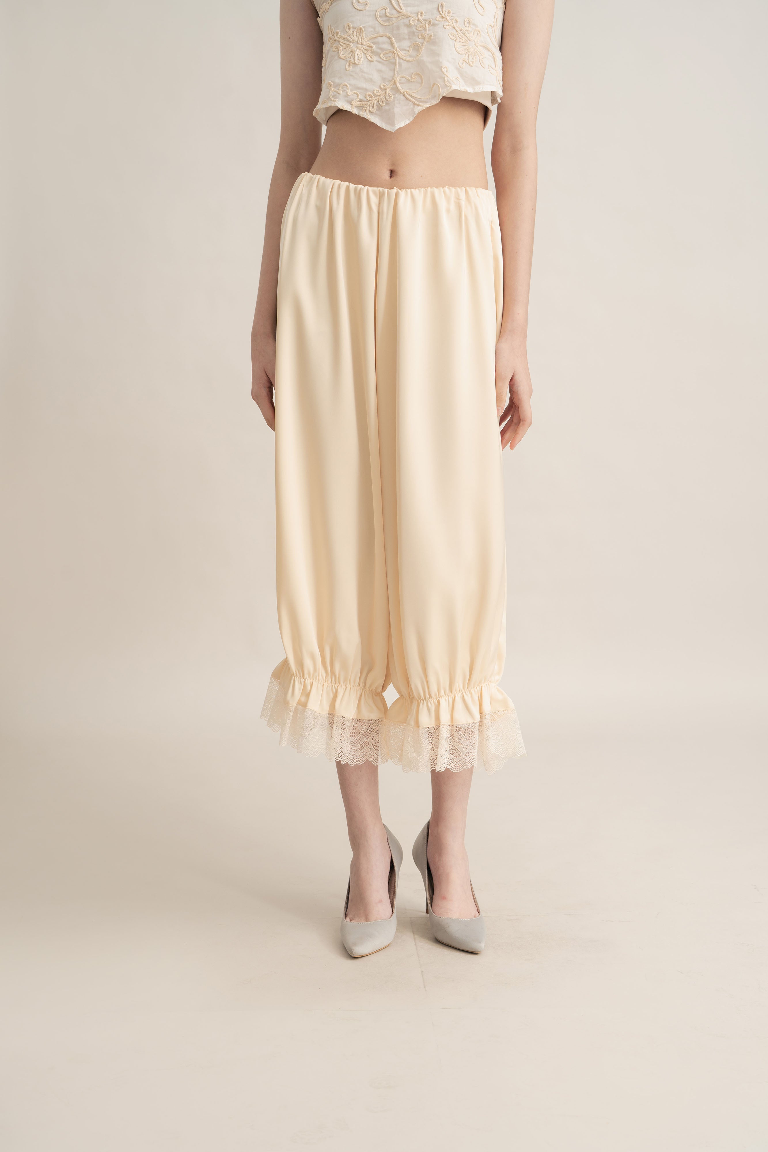 Quiet Peplum Lace Pants in Butter Yellow