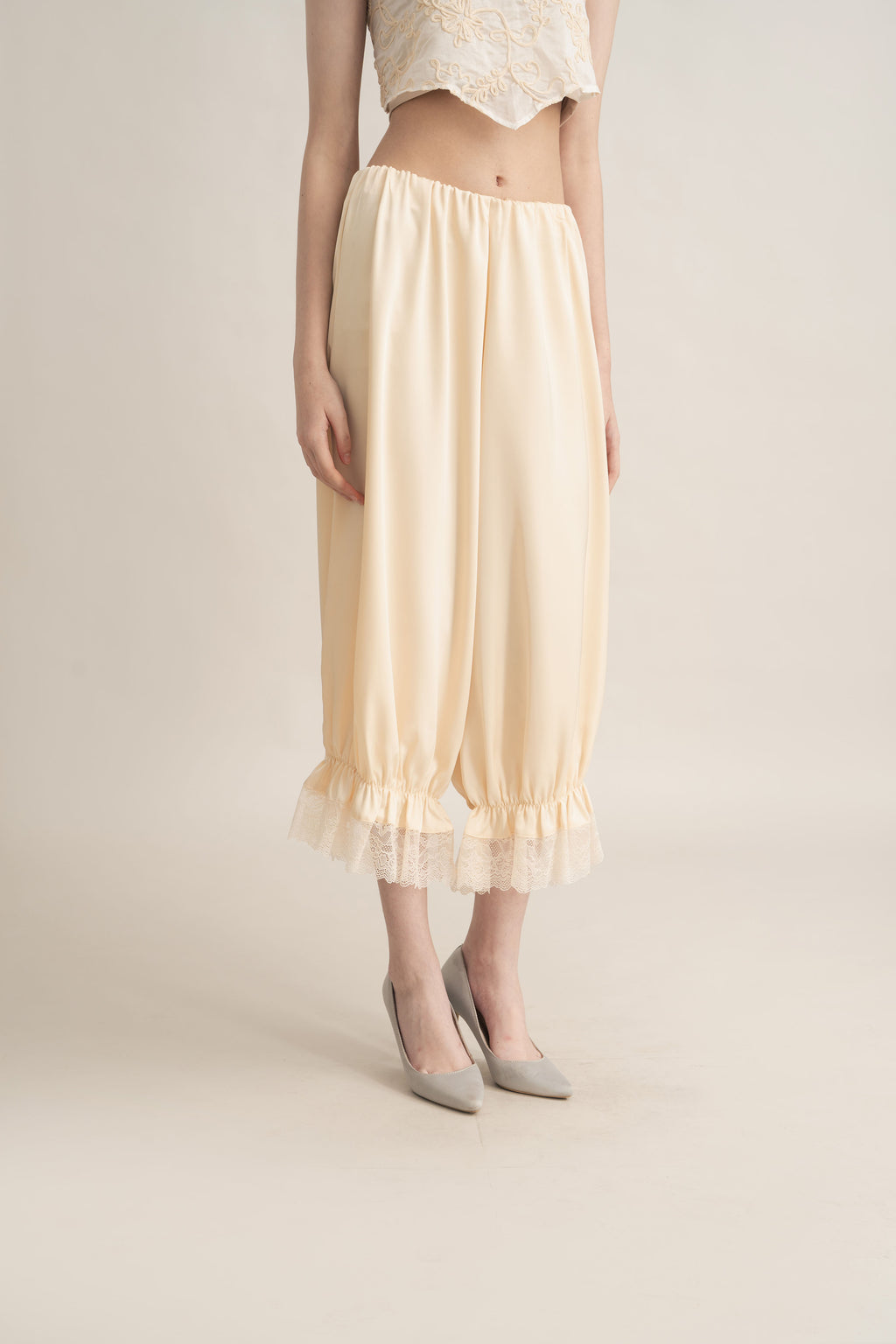 Quiet Peplum Lace Pants in Butter Yellow