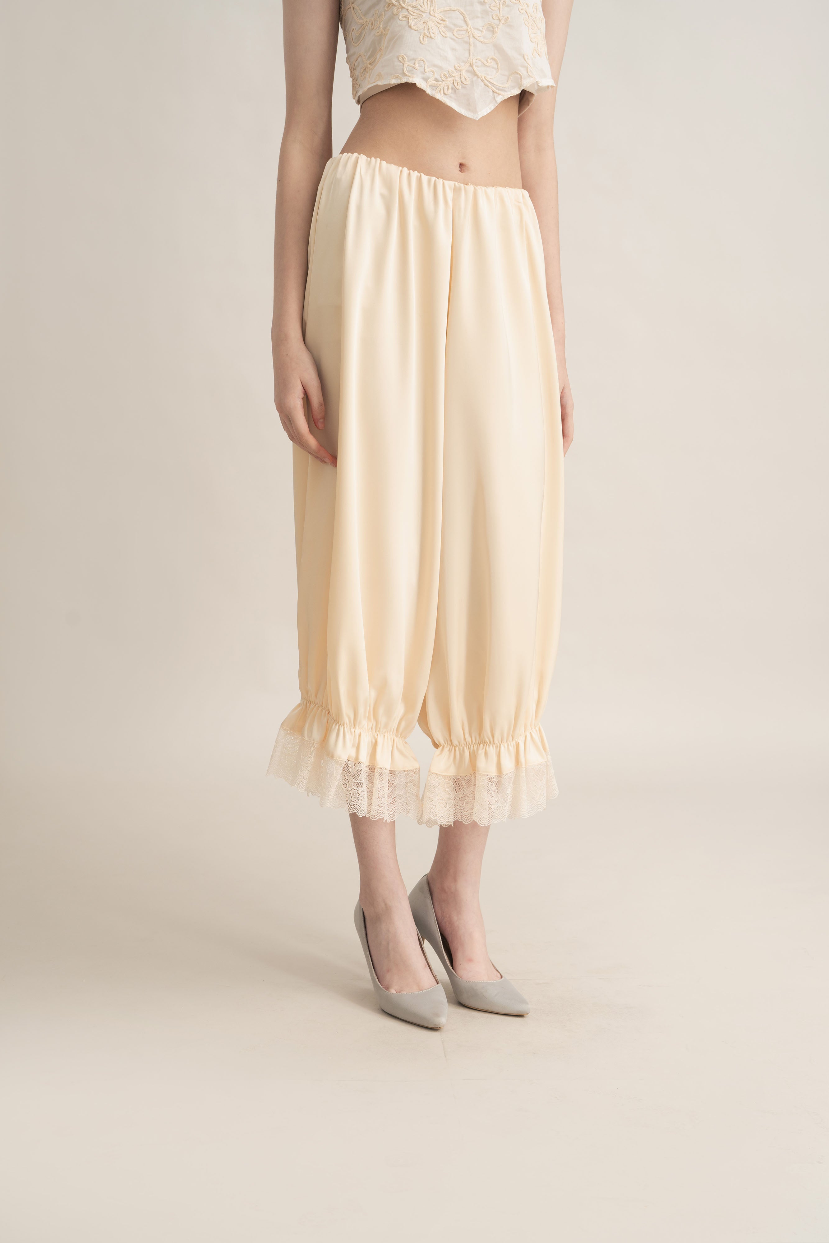 Quiet Peplum Lace Pants in Butter Yellow